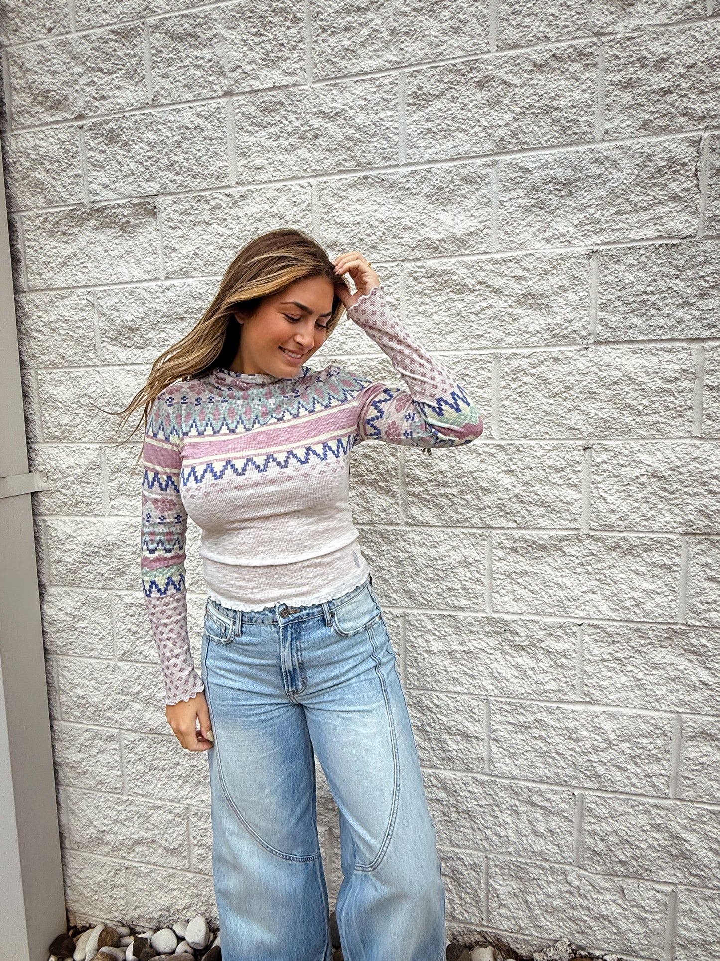 patterned ribbed long sleeve top with lettuce trim and hood. 