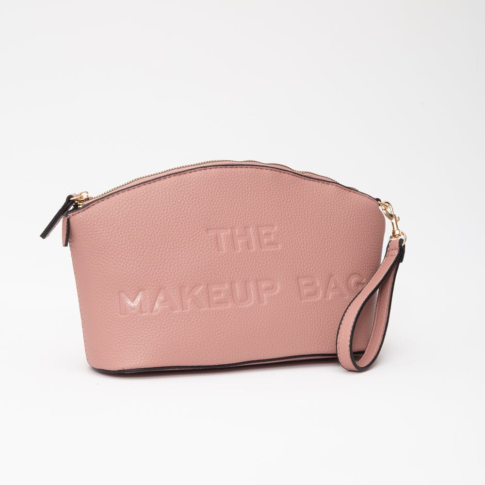 Blush Pink makeup bag featuring “THE MAKEUP BAG” embossed on the front