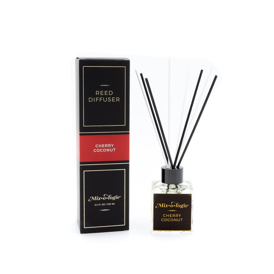 Reed diffuser with packaging labeled 'Cherry Coconut' on a white background