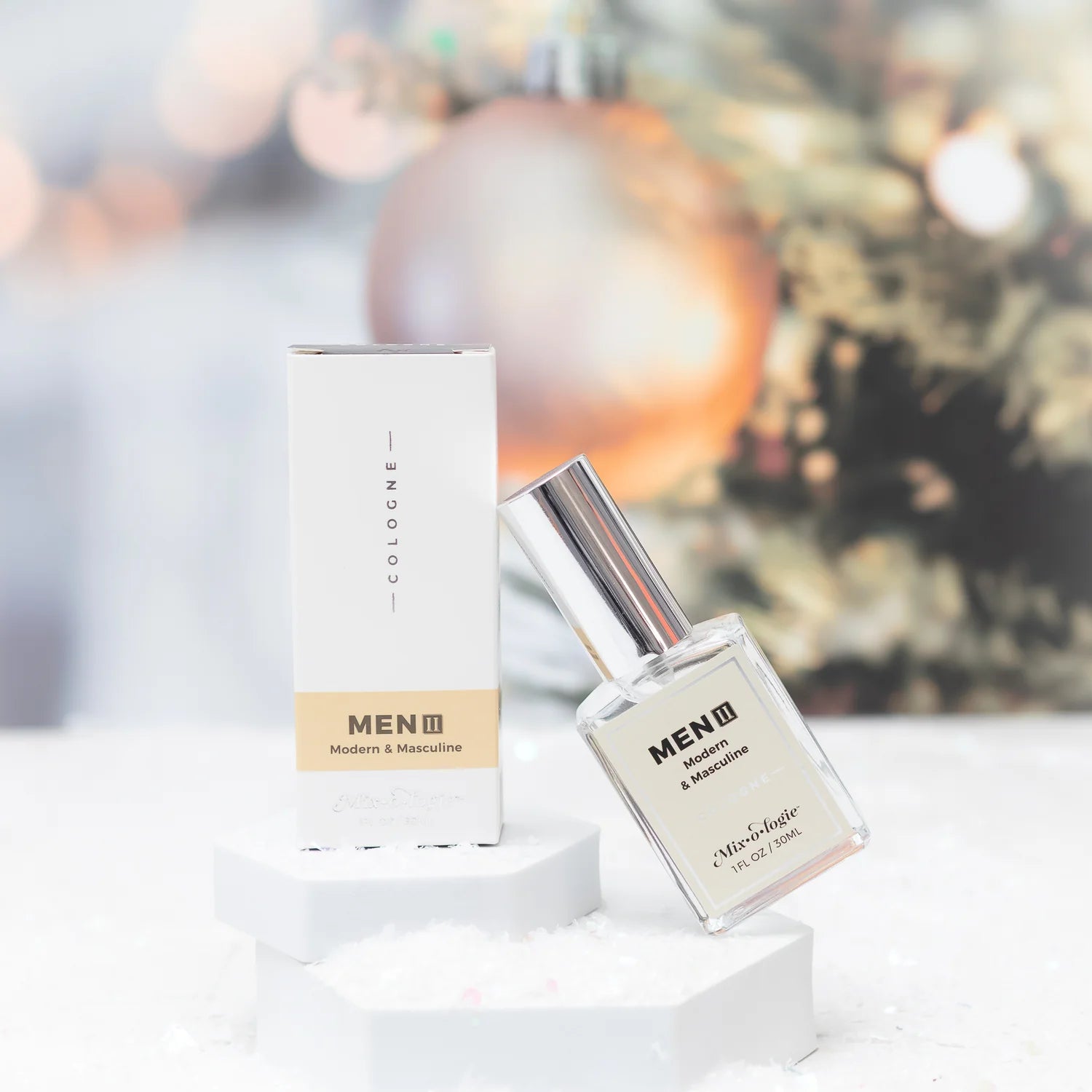 Men's cologne bottle and packaging on a white surface with a blurred background