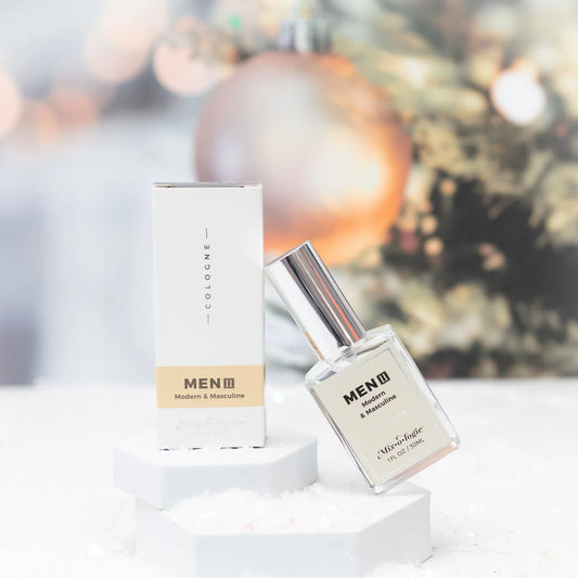 Men's cologne bottle and packaging on a white surface with a blurred background