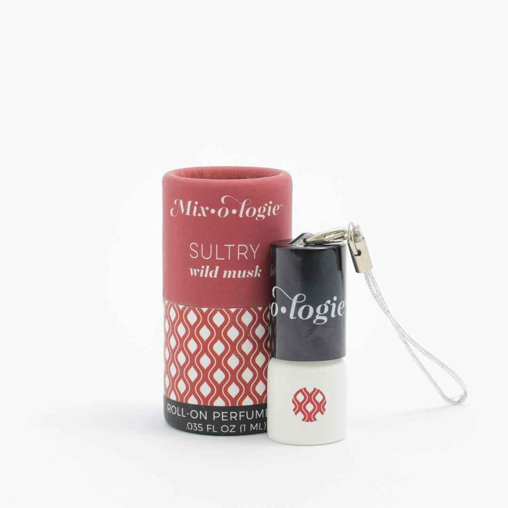 Mixologie Sultry Wild Musk roll-on perfume oil with red patterned packaging and small white bottle featuring a black cap and silver strap