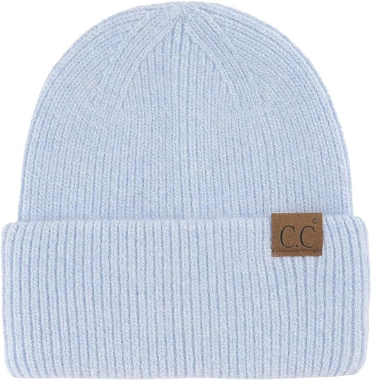 Light blue beanie with a brown label on a white background