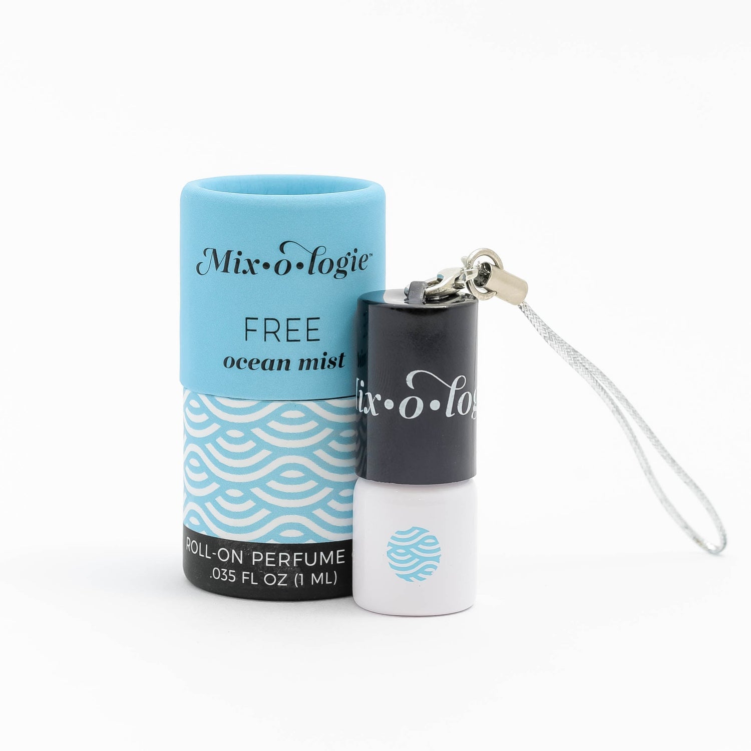 Roll-on perfume with keychain and packaging on a white background