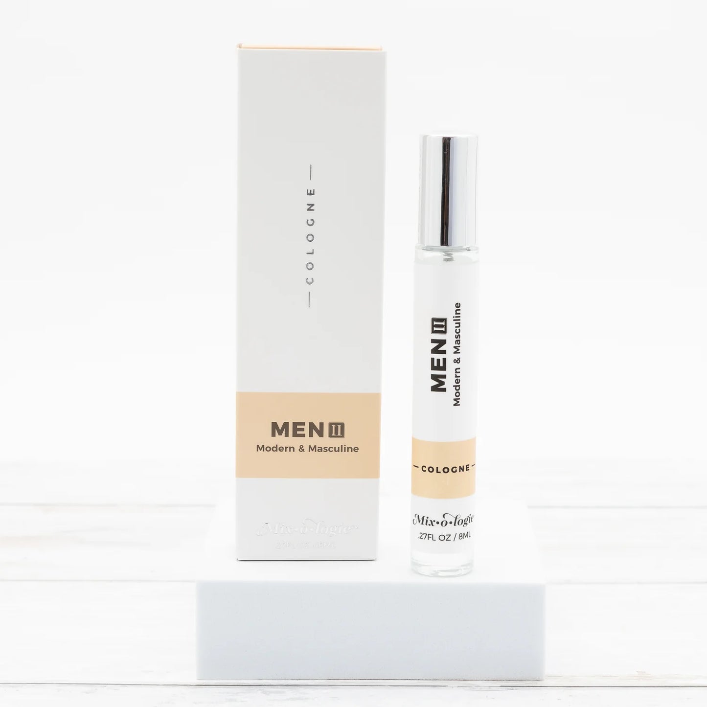 Men's cologne bottle and packaging on a white background