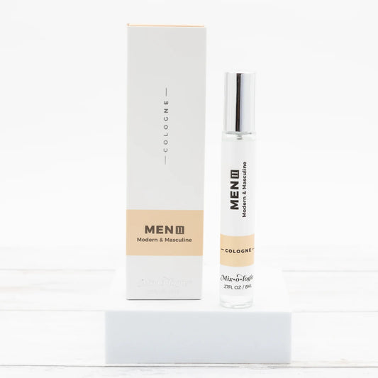 Men's cologne bottle and packaging on a white background