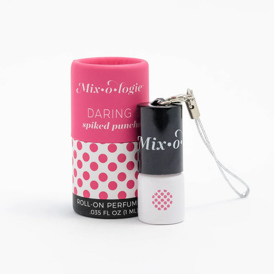 A pink and white keychain mini rollerball perfume with the brand 'MIXOLOGIE' and the scent 'Daring Spiked Punch' displayed on the packaging.