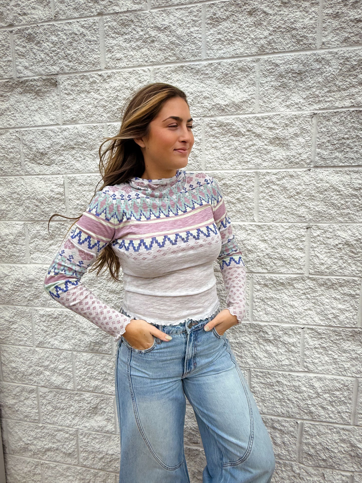 patterned ribbed long sleeve top with lettuce trim and hood. 