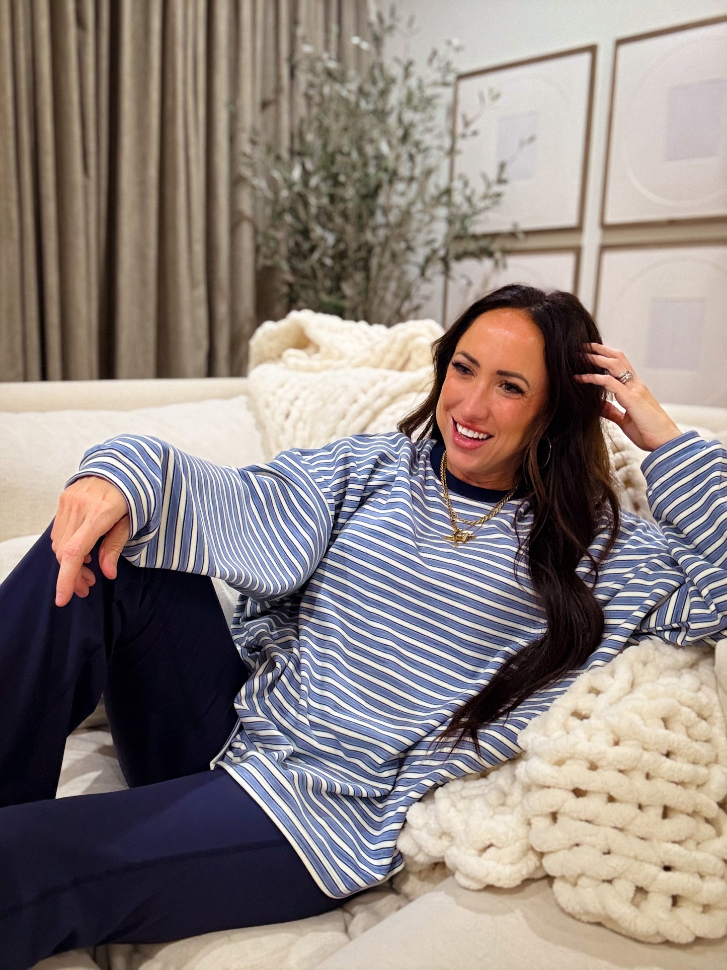 Blue and white striped oversized long-sleeve pullover made from soft, cozy fabric