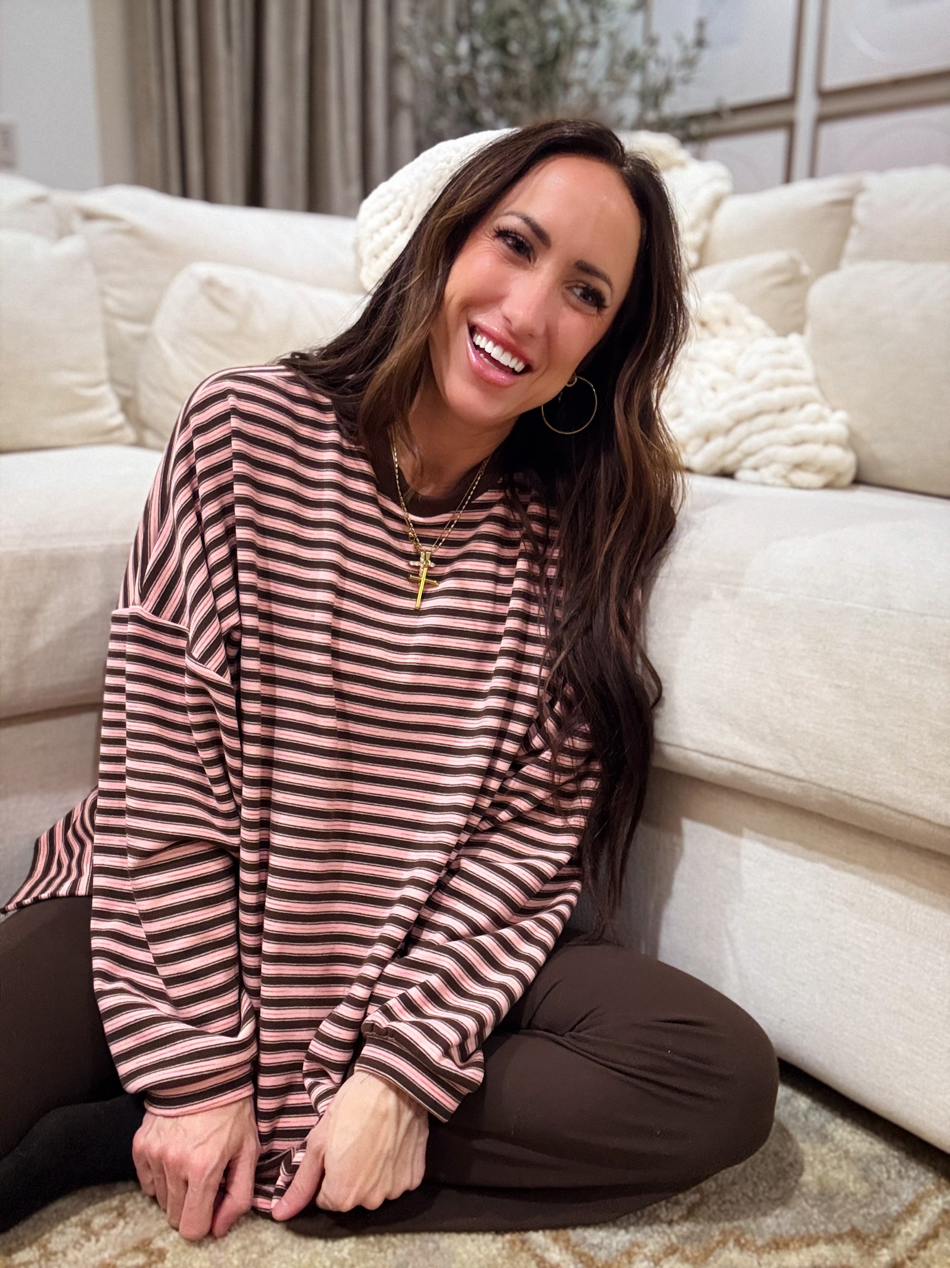 Pink and brown striped oversized long-sleeve pullover made from soft, cozy fabric