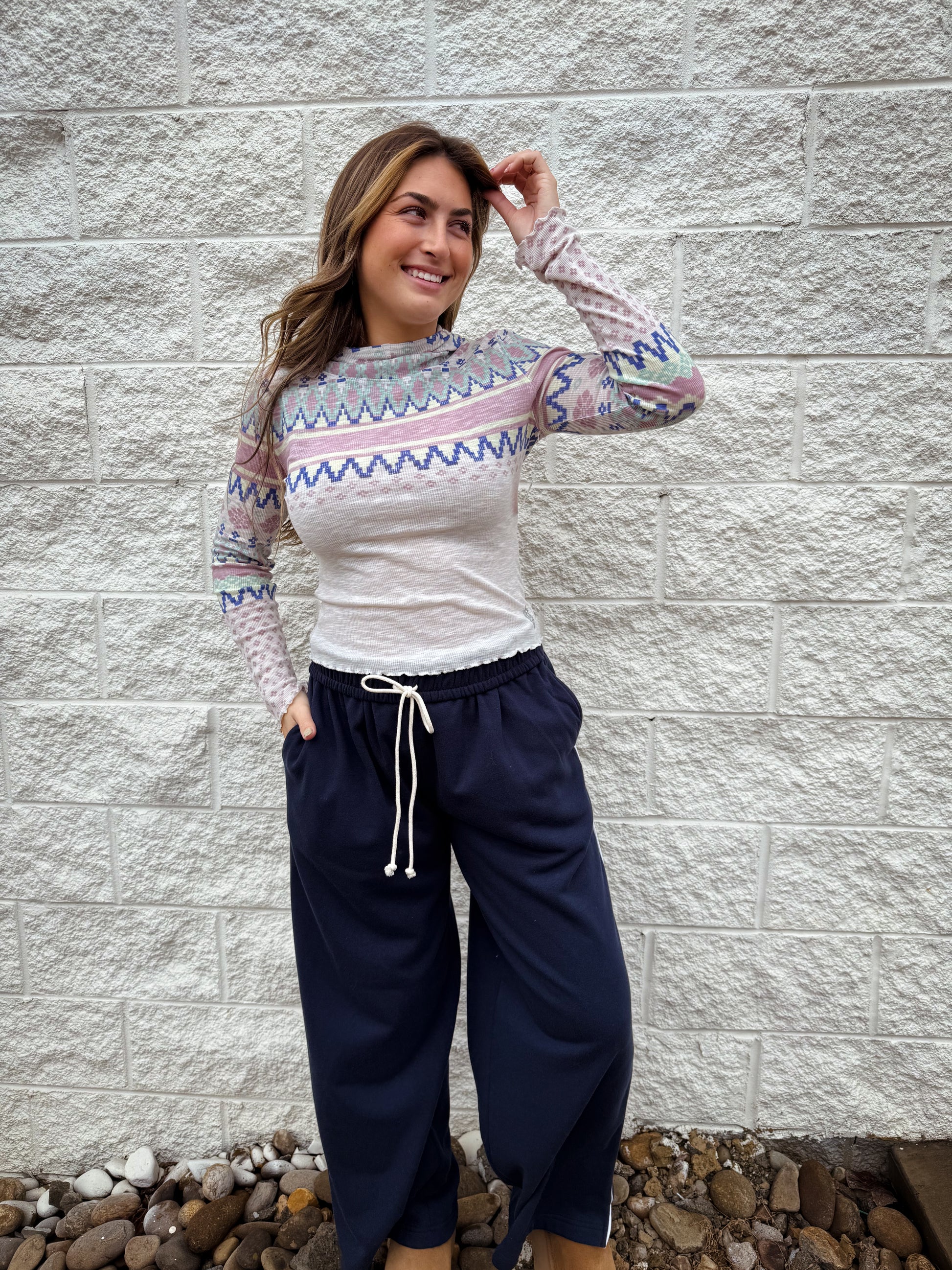 patterned ribbed long sleeve top with lettuce trim and hood paired with navy sweatpants
