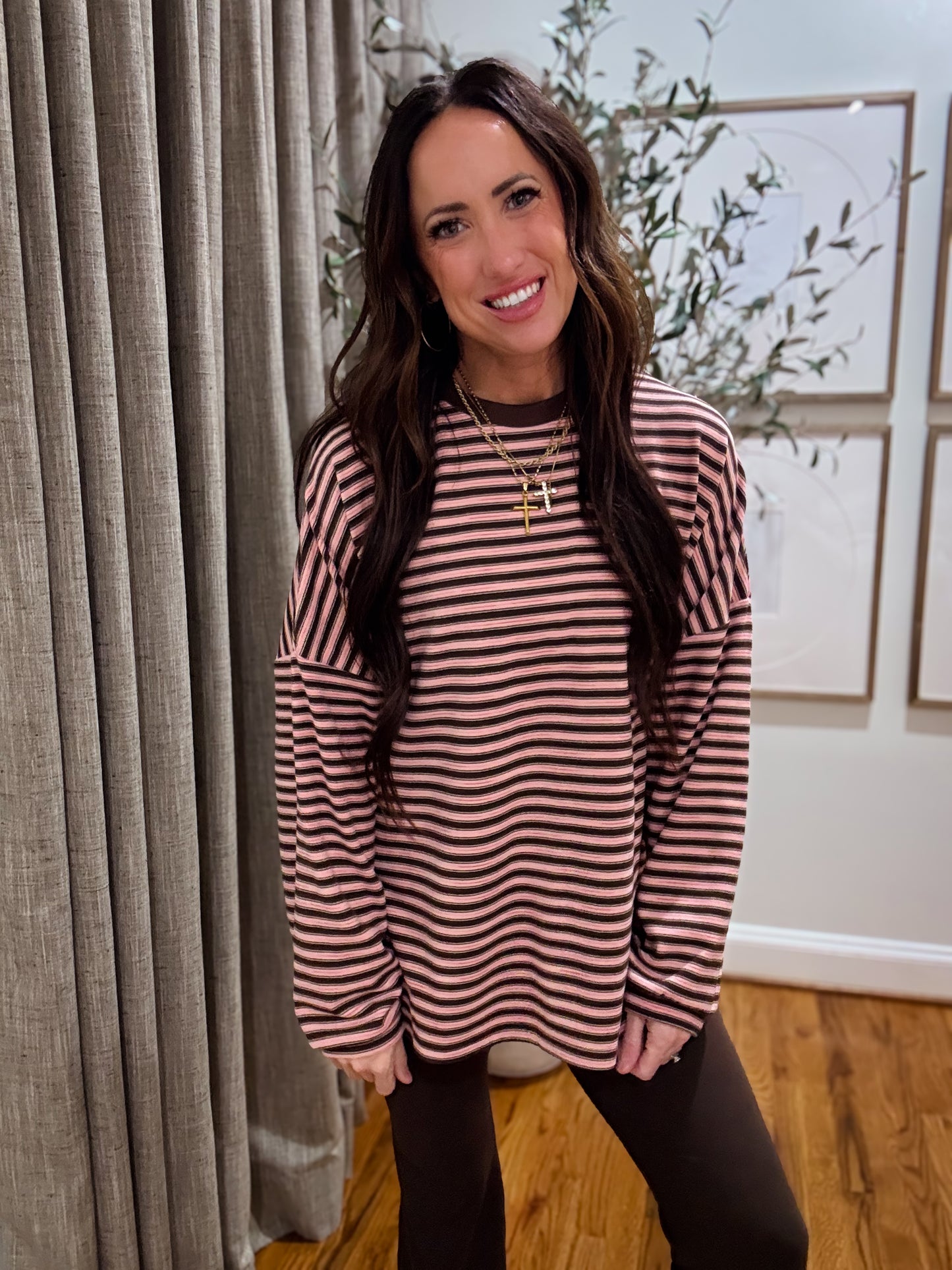 Pink and brown striped oversized long-sleeve pullover made from soft, cozy fabric