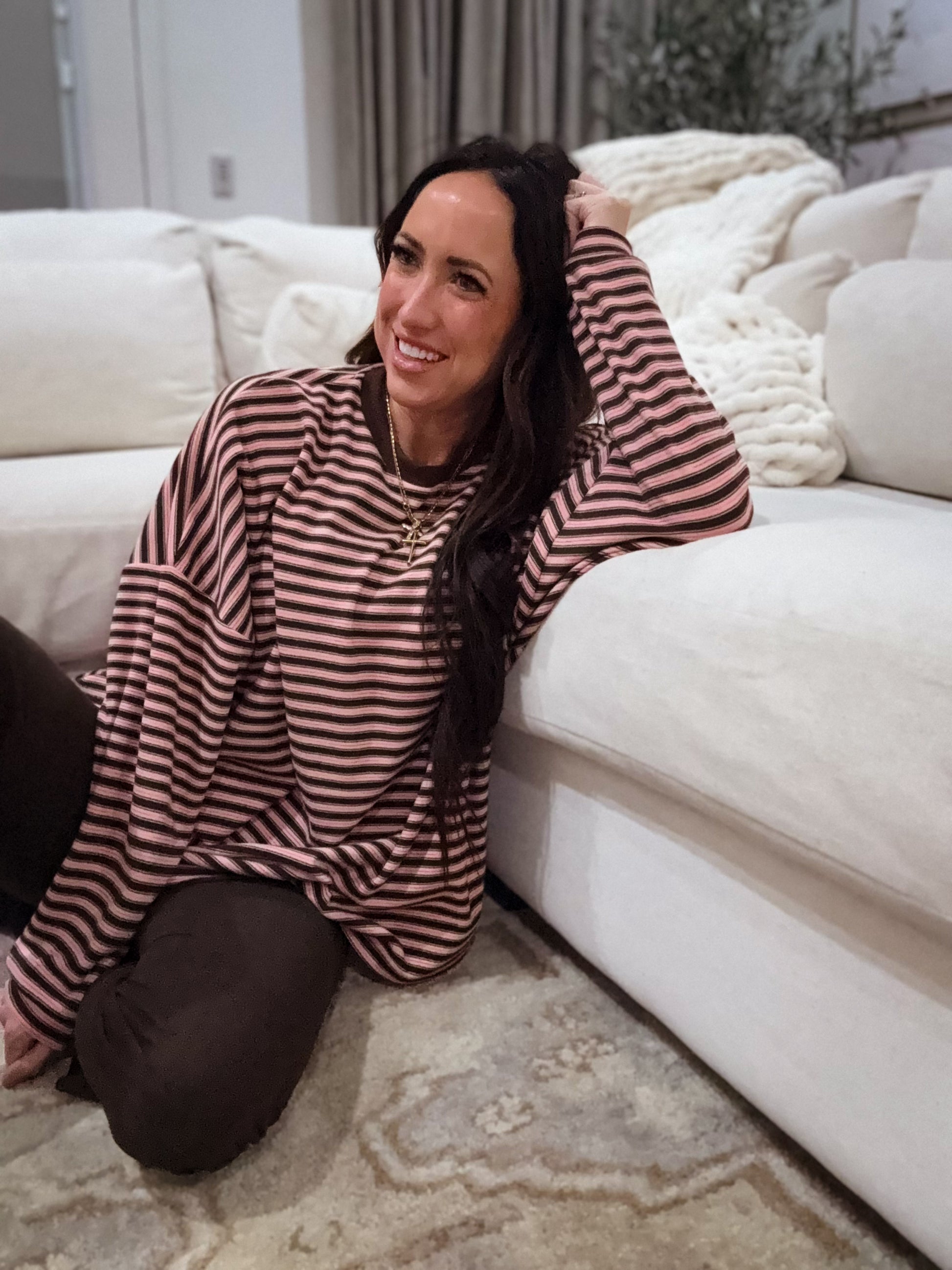 Pink and brown striped oversized long-sleeve pullover made from soft, cozy fabric