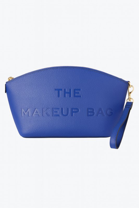 Royal Blue makeup bag featuring “THE MAKEUP BAG” embossed on the front