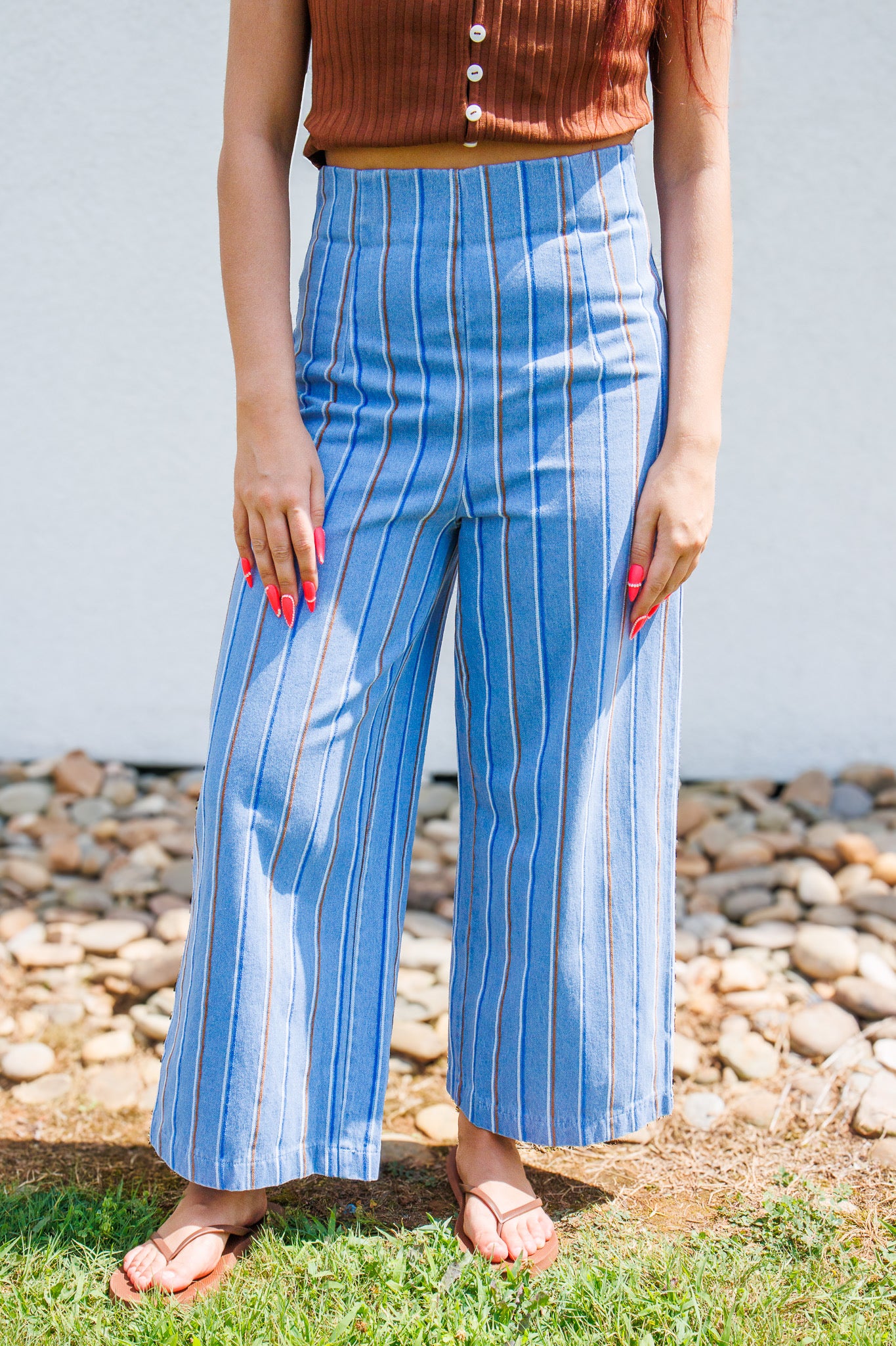 Shop the Café Stripe Wide Leg Pants. Featuring a blue vertical stripe, high-rise fit, and breezy feel. Perfect for brunch or vacations. Shop your new favorite now!