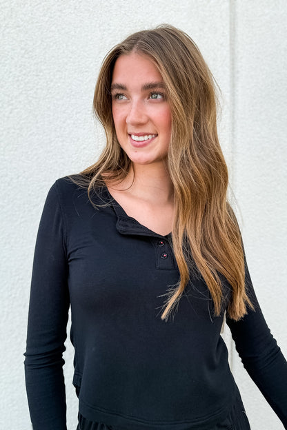 Shop the Dream State Cropped Henley Top. Made from buttery-soft modal with lettuce-trimmed sleeves, it’s the ultimate loungewear essential for everyday comfort.