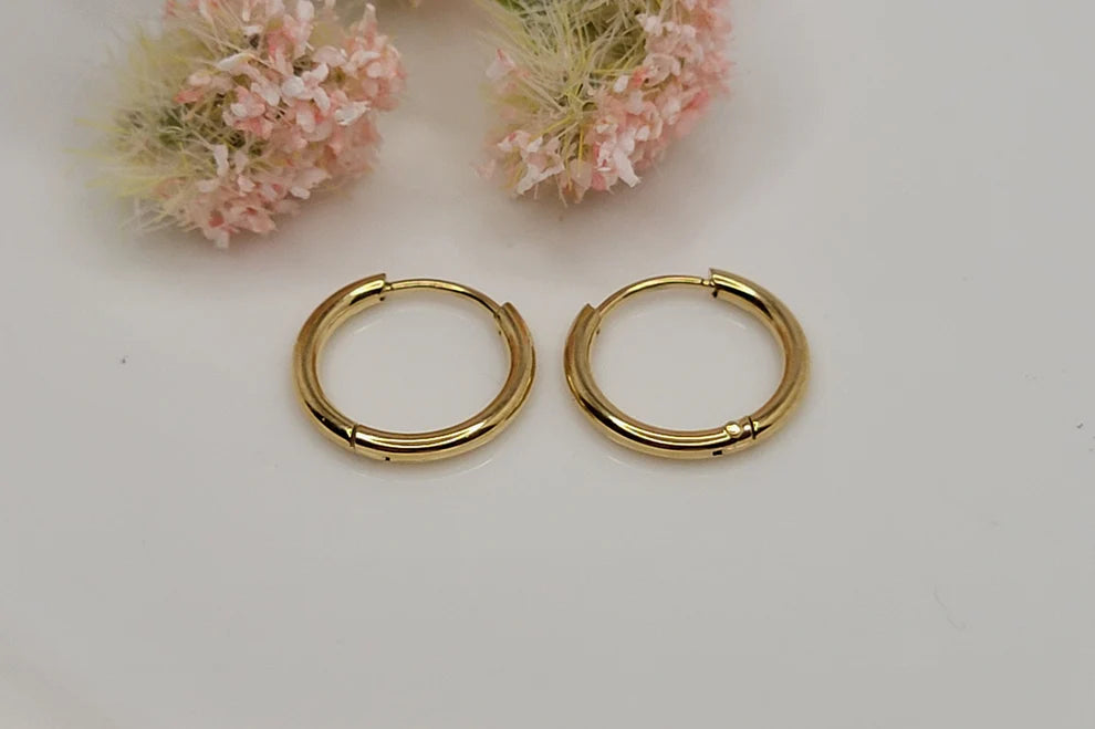 Everlasting Love Gold Huggies featuring classic polished gold huggie hoop earrings, waterproof, tarnish-resistant, hypoallergenic jewelry with a lifetime warranty inspired by Jeremiah 31:3.