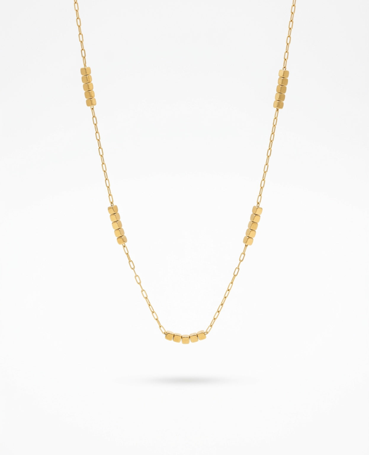 Faithful Steps Cube Necklace featuring a delicate gold chain with polished cube accents, waterproof, tarnish-resistant, hypoallergenic faith-inspired jewelry with a lifetime warranty.