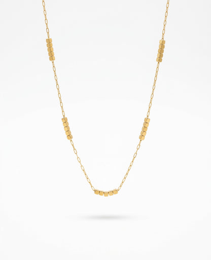 Faithful Steps Cube Necklace featuring a delicate gold chain with polished cube accents, waterproof, tarnish-resistant, hypoallergenic faith-inspired jewelry with a lifetime warranty.