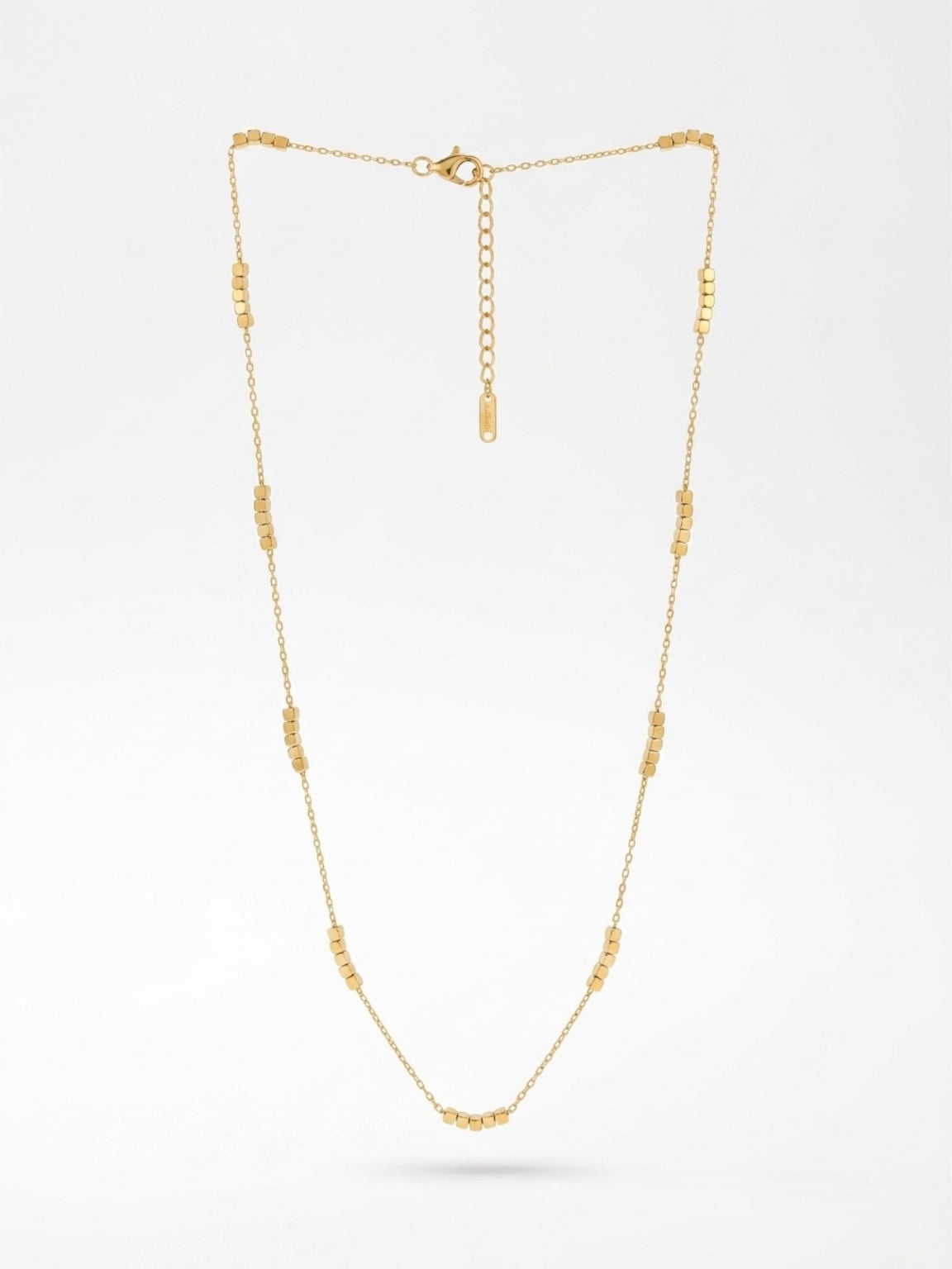 Gold layering necklace with small cubes 