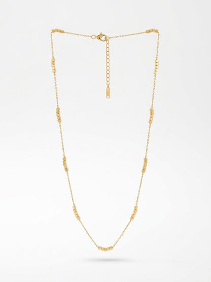 Gold layering necklace with small cubes 