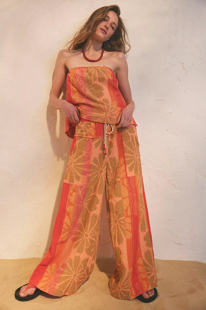 Step into paradise with the Free People Devella Set. This tropical linen-blend strapless top and wide-leg pant duo is your perfect instant vacation outfit.