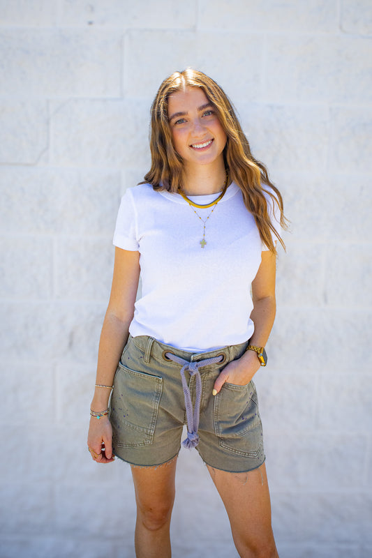 White fitted short sleeve tee styled with olive green drawstring utility shorts and layered jewelry for a trendy summer boutique outfit, perfect for casual weekends, vacations, and everyday wear.