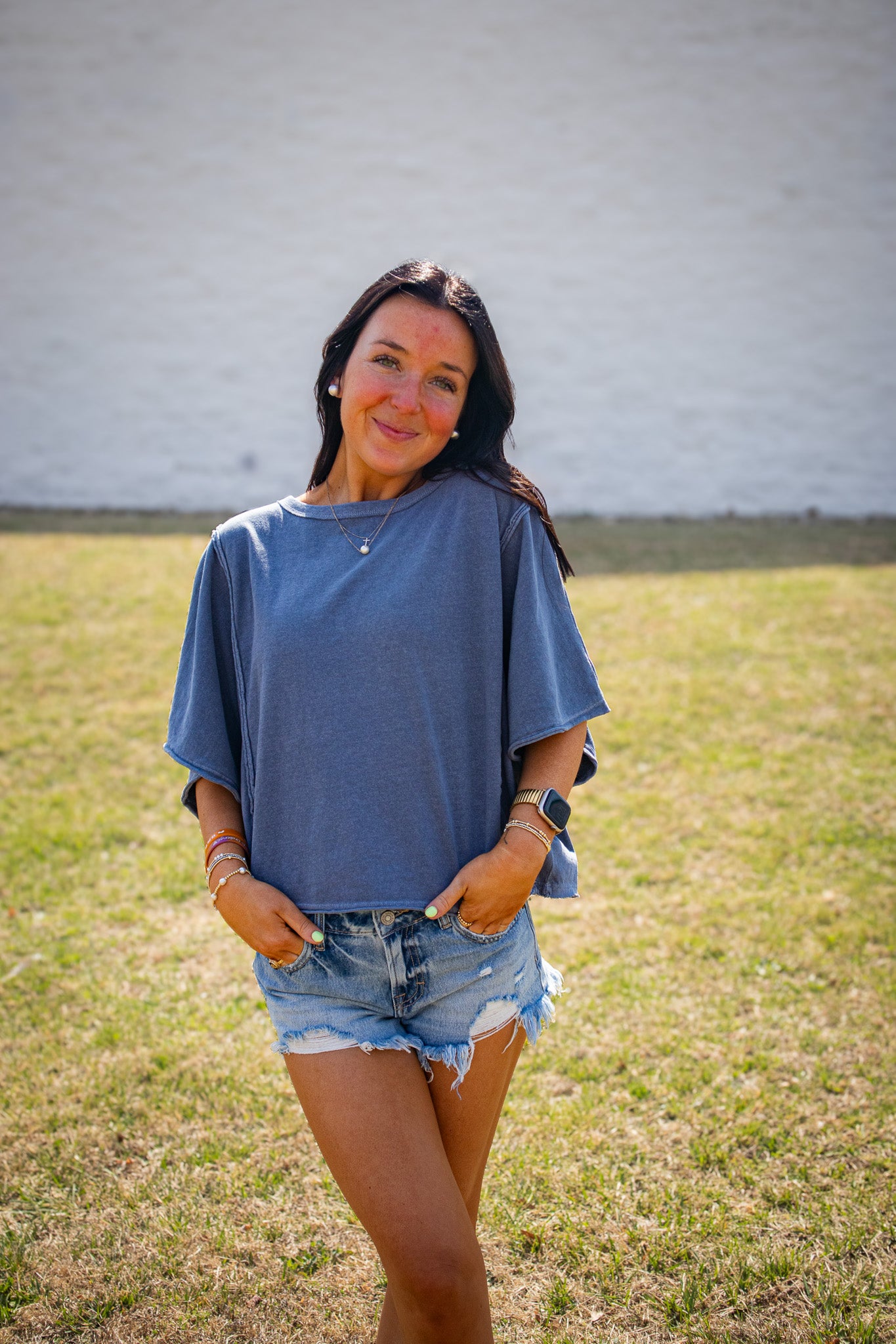 Elevate your style with the Free People Next Level Tee in Night Shadow. Featuring a boxy fit & bat-wing sleeves in 100% US cotton. Shop the ultimate slouchy tee!