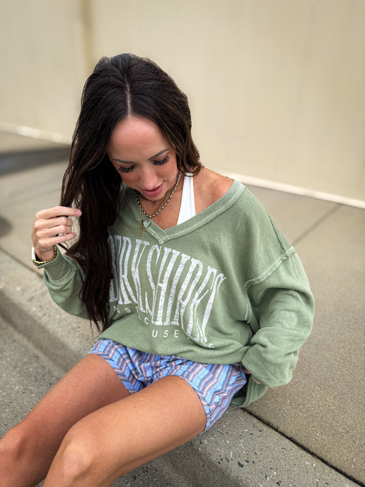 Oversized vintage wash olive green "Berkshire, Massachusetts" graphic sweatshirt featuring a relaxed fit, distressed neckline, dropped shoulders, and long sleeves for a cozy, laid-back everyday look.
