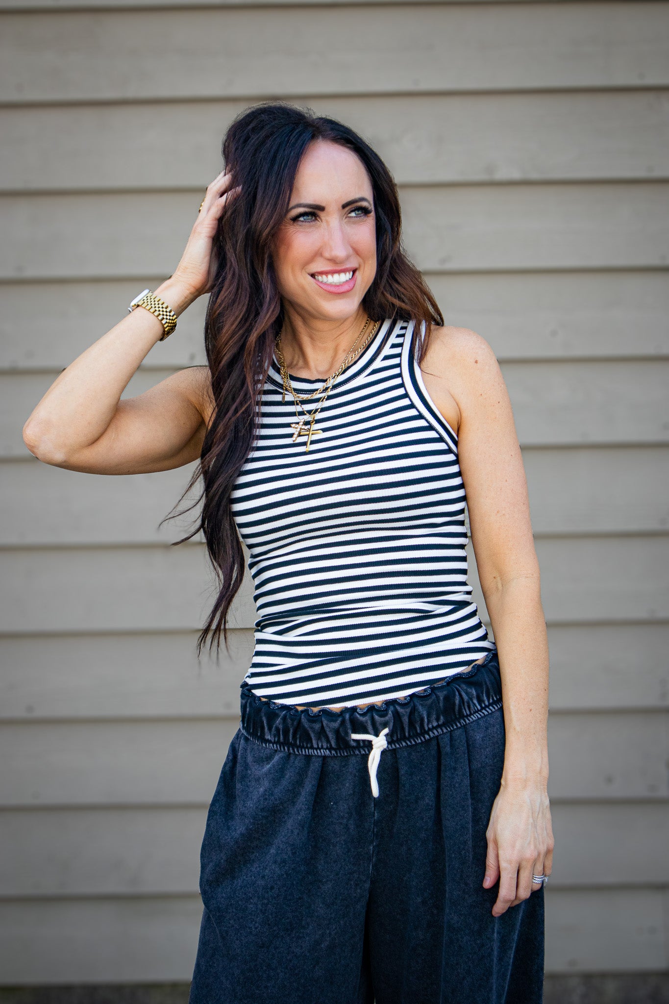Shop the Go-To Striped Tank in black and white. A soft, ribbed racerback essential with a flattering fit and breathable cotton. Perfect for everyday style. Buy now!