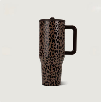 Brown leopard print insulated leak proof tumbler with black spots, a matching dark brown handle, and lid in a tall travel cup design.