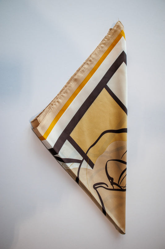 Decorative scarf with geometric pattern on a light gray background