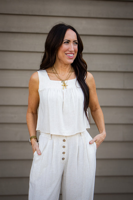 Shop the Linen Sands Flowy Top. A breathable square-neck linen tank designed for effortless style and maximum comfort. Perfect for summer days and travel.