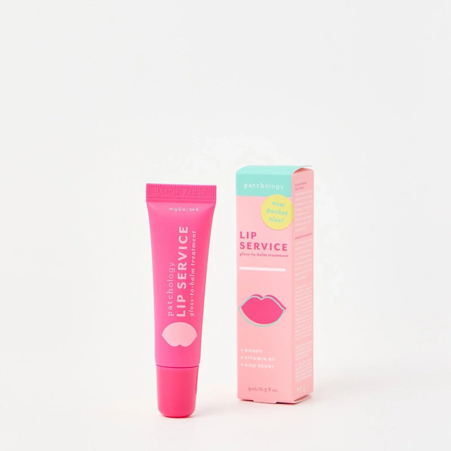 Patchology Lip Service gloss-to-balm lip treatment in bright pink tube with matching pink and teal box, hydrating lip balm with honey, vitamin B5, and goji berry.