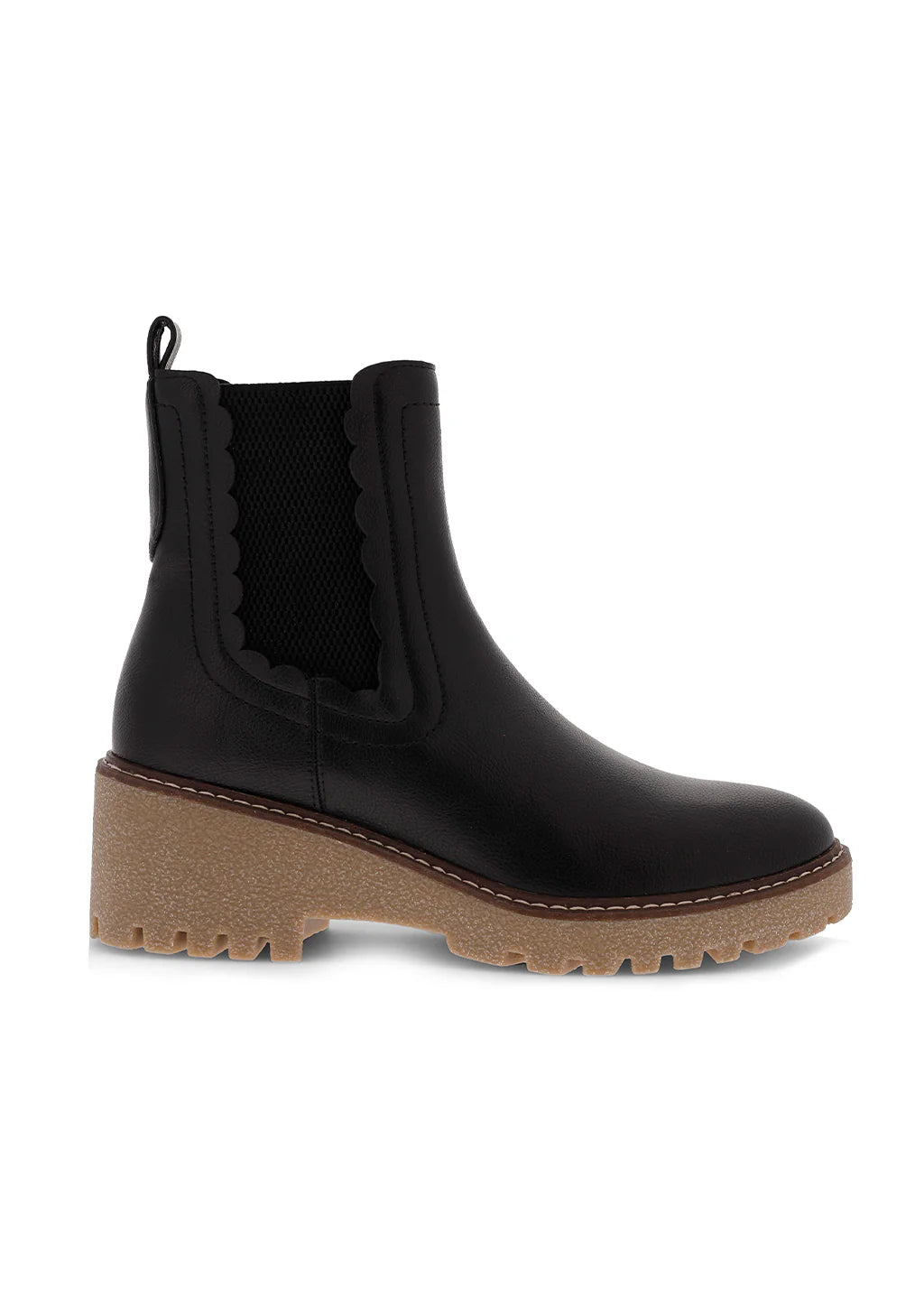 Black faux leather Chelsea ankle boot featuring scalloped trim, elastic side panels, pull tab, and a chunky tan lug platform sole for a stylish everyday fall look.