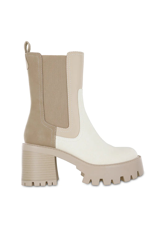 Two-tone ivory and beige Chelsea ankle boot featuring faux leather panels, elastic side gussets, pull tab, chunky block heel, and a platform lug sole for a modern fall wardrobe staple.
