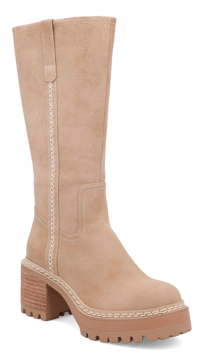 Tall sand suede knee-high boot featuring decorative whipstitch detailing, a chunky block heel, platform lug sole, and round toe for a stylish fall and winter look.