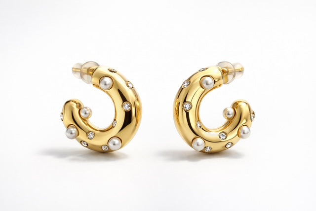 Gold hoop earrings with pearl and crystal accents, featuring a chunky high-shine polished finish