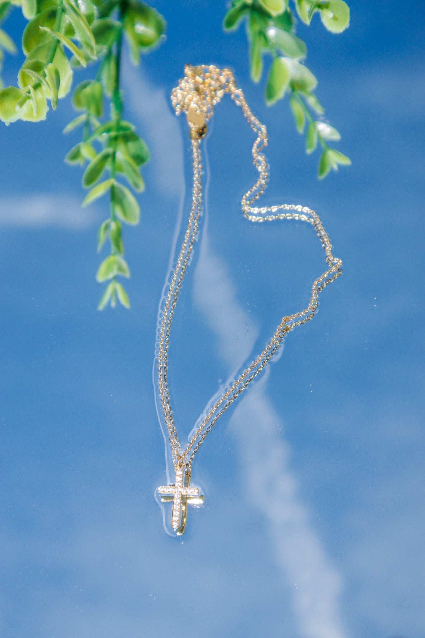 Radiant Faith Gold Pavé Cross Necklace featuring a sparkling pavé cross pendant on a delicate gold chain, waterproof and tarnish-resistant Christian jewelry with a lifetime warranty.