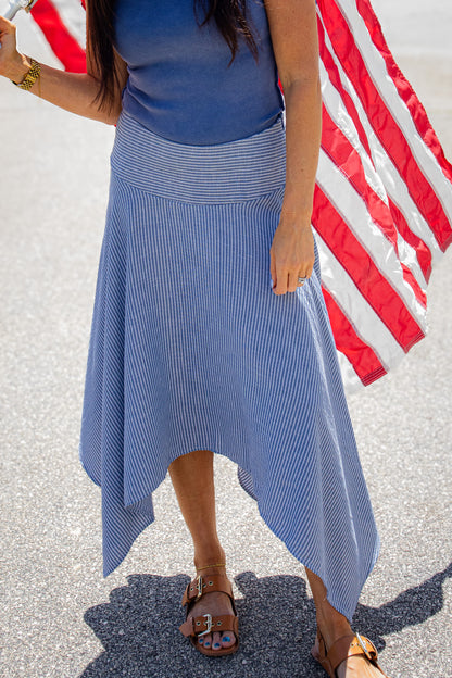 Copy
Elevate your look with our Seaside Stripe Midi Skirt. Featuring a flattering handkerchief hem and sleek linen fit, it’s perfect for effortless coastal style.