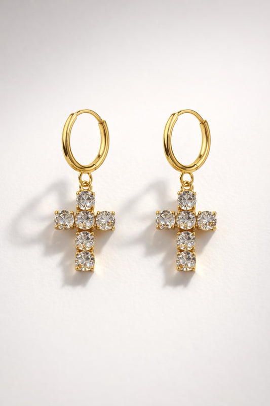Gold huggie hoop earrings with crystal cross drop and high-shine polished finish