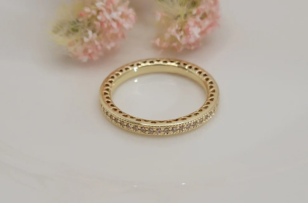 Unfailing Love Eternity Pavé Ring featuring a sparkling gold eternity band with pavé stones, waterproof, tarnish-resistant, hypoallergenic faith-inspired jewelry with a lifetime warranty.
