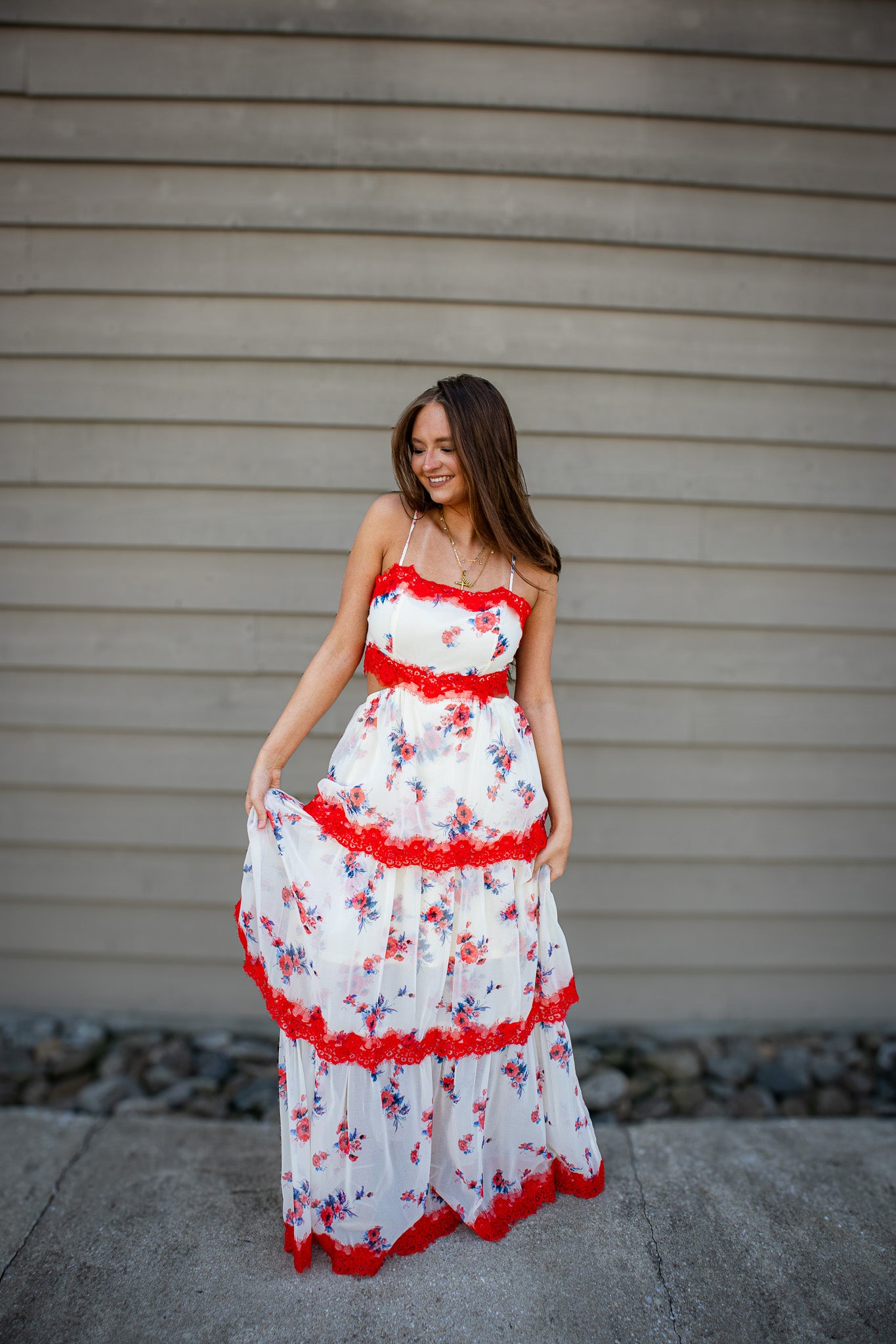 Turn heads in the Wild Rose Floral Maxi. Featuring bold scarlet lace, a sultry tie-back, and a tiered silhouette perfect for summer weddings and vacations.